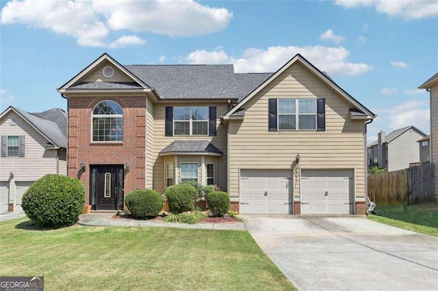 front of property with a garage and a front lawn