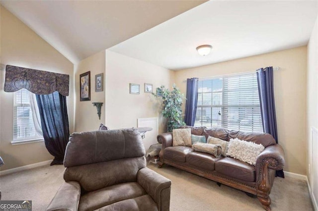 living room with carpet and lofted ceiling