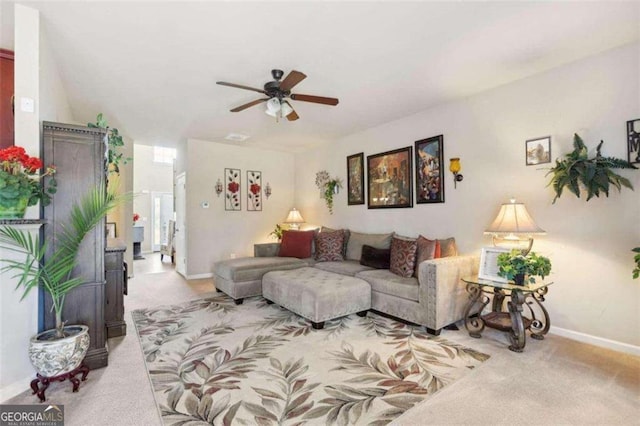 living room with light carpet and ceiling fan