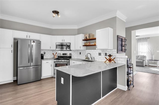 5990 Eagle Tiff Ln, Sugar Hill, GA 30518 - kitchen with stainless steel appliances, light stone counters, light wood finished floors, open shelves, and crown molding