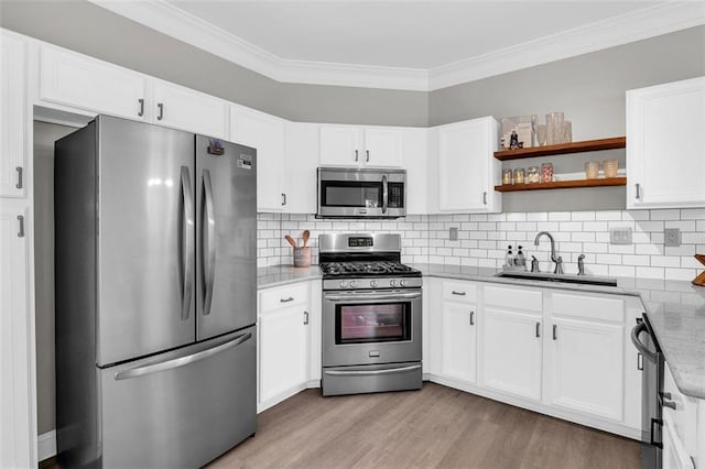 5990 Eagle Tiff Ln, Sugar Hill, GA 30518 - kitchen with appliances with stainless steel finishes, crown molding, white cabinets, light stone countertops, and light wood-style floors