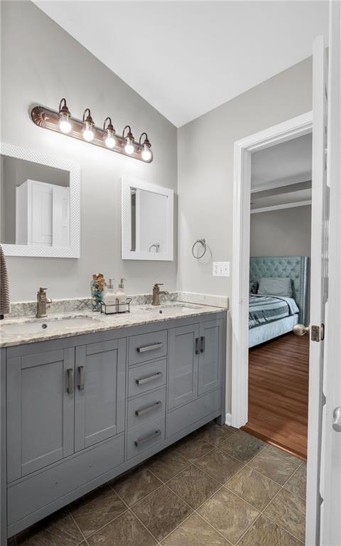 5990 Eagle Tiff Ln, Sugar Hill, GA 30518 - full bath featuring ensuite bath, double vanity, and stone finish floors