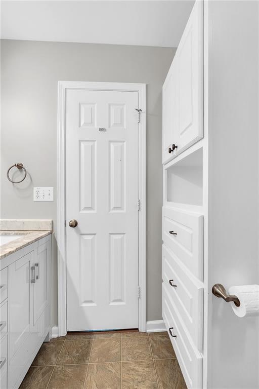 5990 Eagle Tiff Ln, Sugar Hill, GA 30518 - bathroom featuring vanity and baseboards