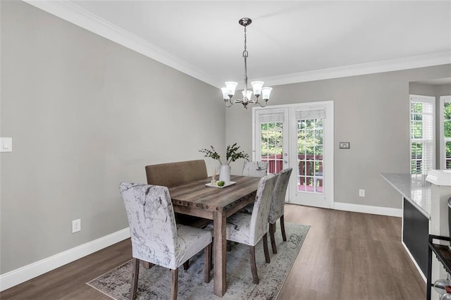 5990 Eagle Tiff Ln, Sugar Hill, GA 30518 - dining area featuring a chandelier, dark wood-style floors, and ornamental molding