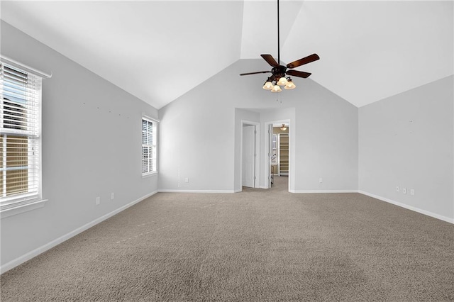 unfurnished room with ceiling fan, lofted ceiling, and carpet floors