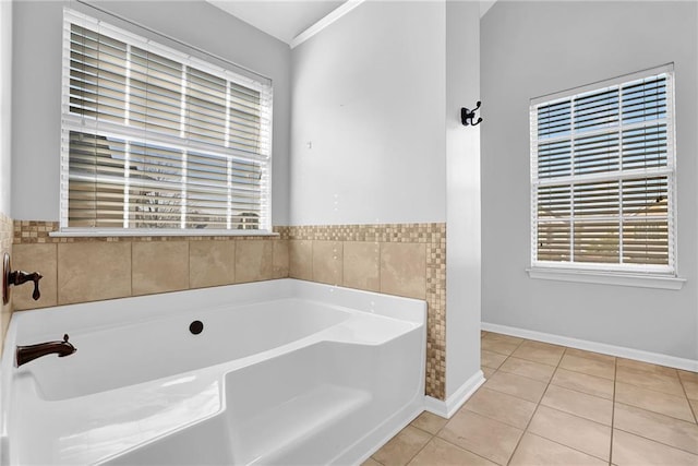 bathroom featuring a washtub and tile patterned floors