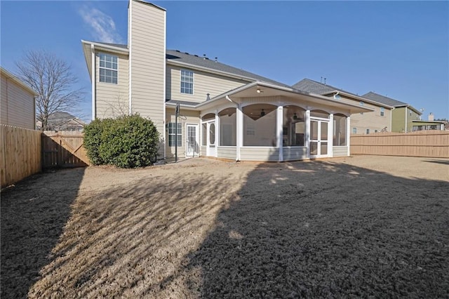 back of property featuring a sunroom