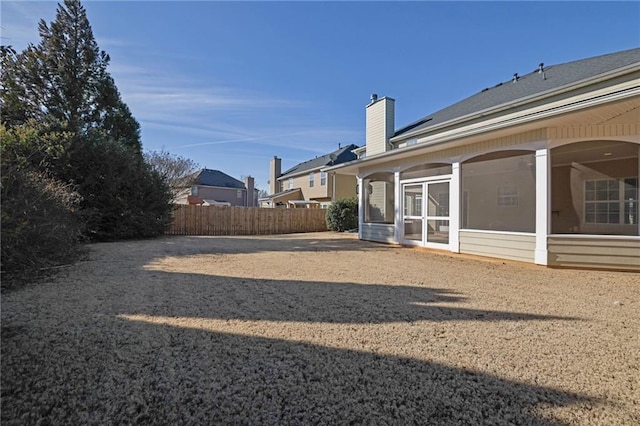 view of yard featuring a sunroom