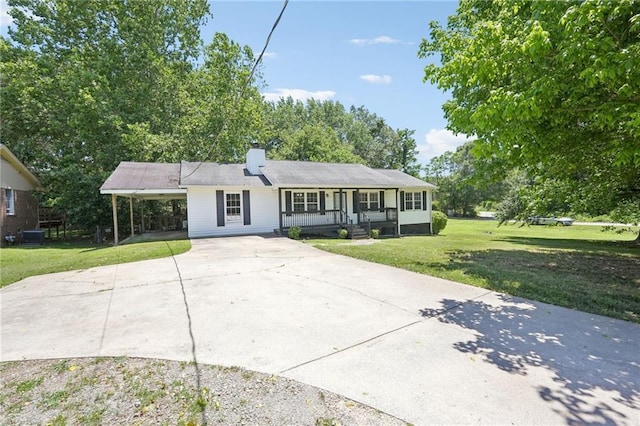 3388 Hamilton Mill Rd, Buford, GA 30519 - ranch-style home with driveway, covered porch, a front lawn, an attached carport, and a chimney