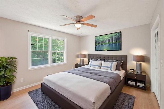 3388 Hamilton Mill Rd, Buford, GA 30519 - bedroom with light wood-style floors, baseboards, and ceiling fan