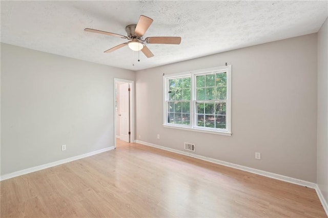 3388 Hamilton Mill Rd, Buford, GA 30519 - spare room with light wood-style flooring, baseboards, a ceiling fan, and a textured ceiling