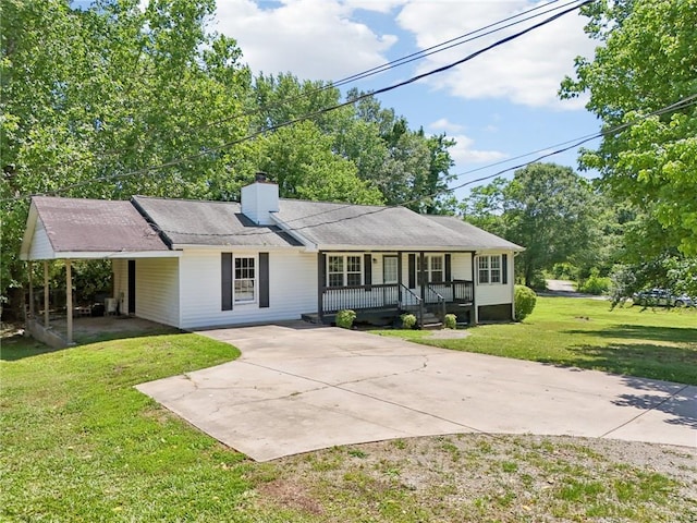 3388 Hamilton Mill Rd, Buford, GA 30519 - ranch-style home featuring covered porch, concrete driveway, a chimney, a front yard, and a carport