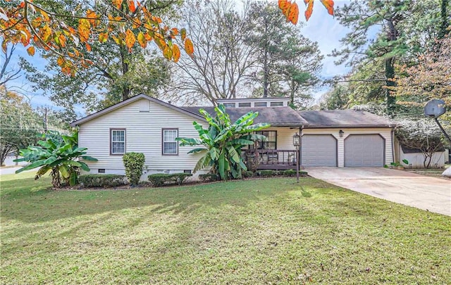 view of front of house featuring a front yard and a garage