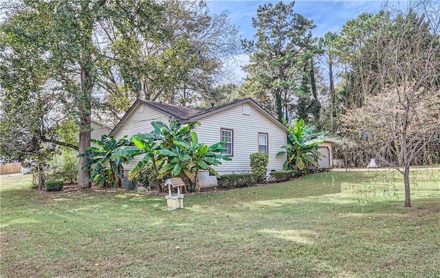 view of home's exterior with a yard