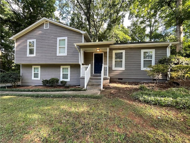 tri-level home featuring a front lawn