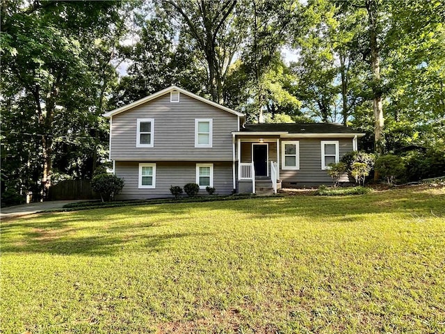 split level home featuring a front lawn