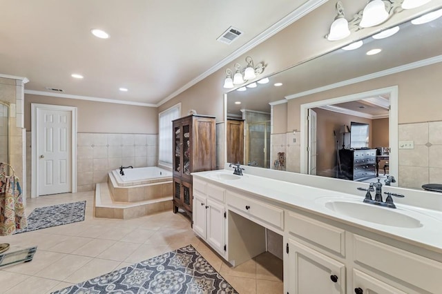 full bathroom with tile patterned floors, visible vents, a shower stall, and a sink