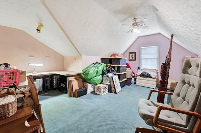 bonus room featuring a textured ceiling, lofted ceiling, carpet, and a ceiling fan