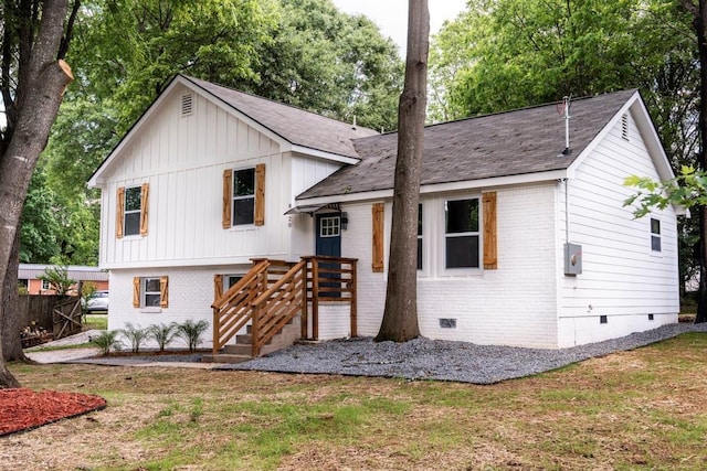 8420 Sheridan Dr, Jonesboro, GA 30236 - view of front of property featuring brick siding, crawl space, a front lawn, and board and batten siding