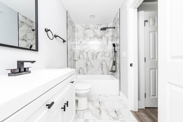 8420 Sheridan Dr, Jonesboro, GA 30236 - bathroom with vanity, marble look tiles, shower / tub combination, toilet, and baseboards