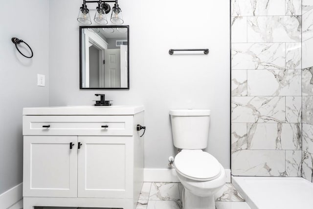 8420 Sheridan Dr, Jonesboro, GA 30236 - bathroom with marble look tiles, toilet, vanity, baseboards, and a tile shower