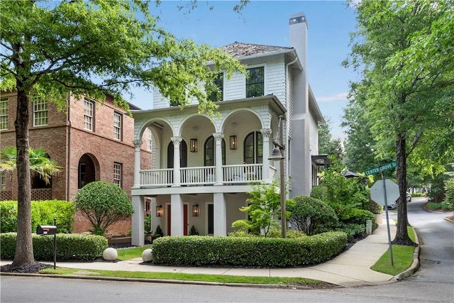 view of front of home featuring a porch and a balcony