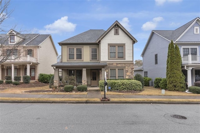 view of front of home featuring central AC unit and covered porch