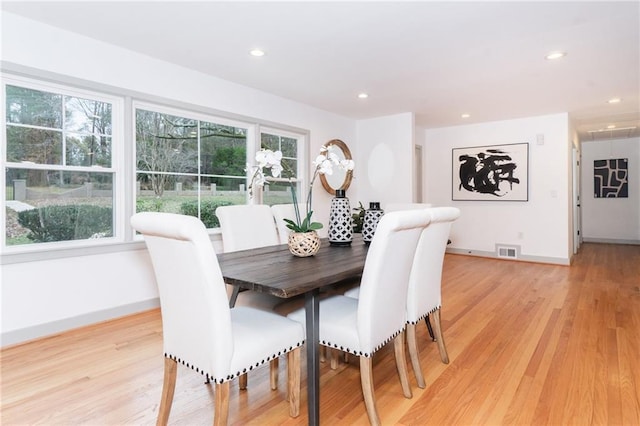 dining area with light wood-type flooring