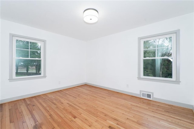 unfurnished room featuring light hardwood / wood-style flooring