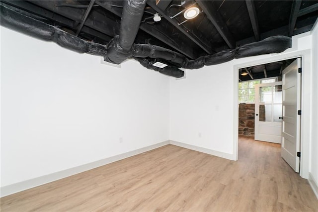 basement featuring wood-type flooring