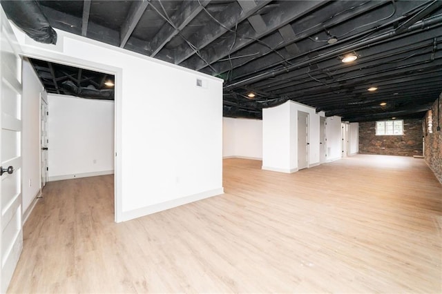 basement featuring light wood-type flooring