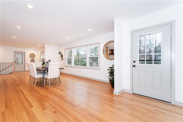 dining space featuring light wood-type flooring