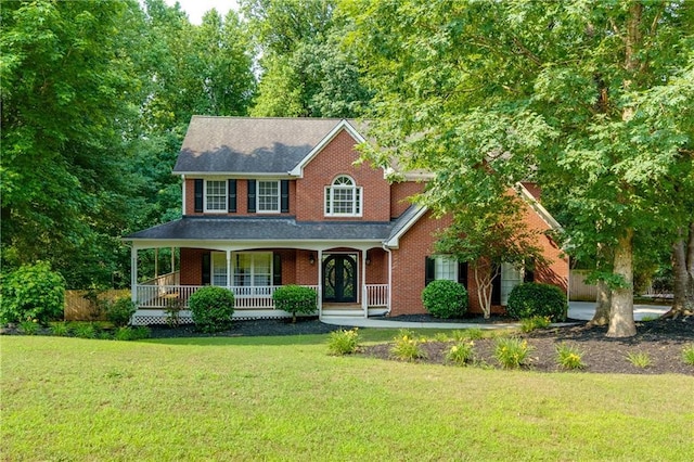 2995 Aspen Ridge Ct, Snellville, GA 30078 - view of front of home featuring brick siding, a front lawn, and a porch