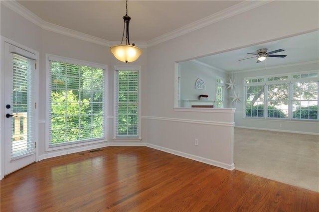 2995 Aspen Ridge Ct, Snellville, GA 30078 - unfurnished dining area with ornamental molding, ceiling fan, wood finished floors, and baseboards