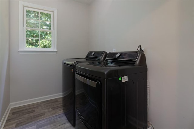 2995 Aspen Ridge Ct, Snellville, GA 30078 - washroom featuring independent washer and dryer, wood finished floors, and baseboards