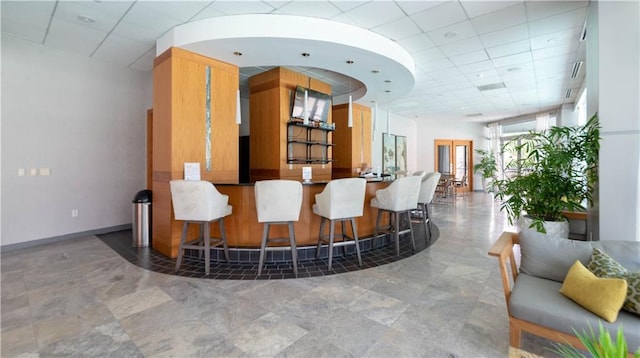 3338 Peachtree Rd NE Unit 1506, Atlanta, GA 30326 - bar featuring a paneled ceiling and baseboards