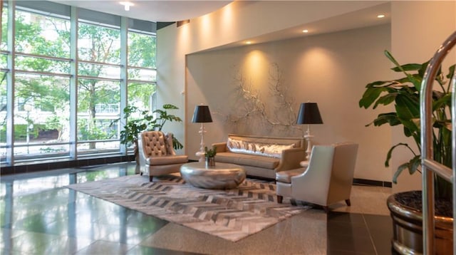 3338 Peachtree Rd NE Unit 1506, Atlanta, GA 30326 - common area featuring expansive windows, recessed lighting, and a towering ceiling