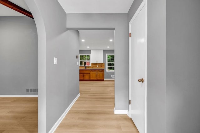 4260 Bonaparte Dr, Tucker, GA 30084 - hallway with light wood-style floors, arched walkways, and recessed lighting