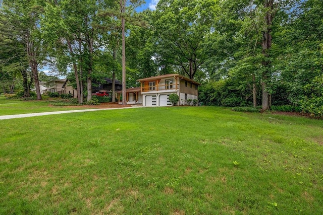 4260 Bonaparte Dr, Tucker, GA 30084 - view of grassy yard featuring an attached garage