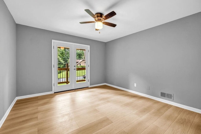 4260 Bonaparte Dr, Tucker, GA 30084 - spare room with a ceiling fan, light wood-style floors, and french doors