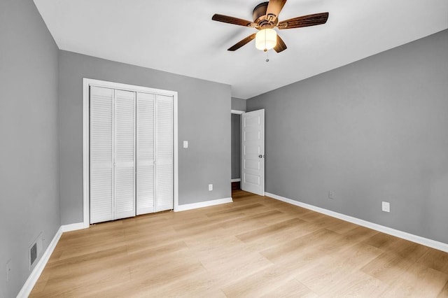 4260 Bonaparte Dr, Tucker, GA 30084 - unfurnished bedroom featuring light wood finished floors, a closet, and a ceiling fan