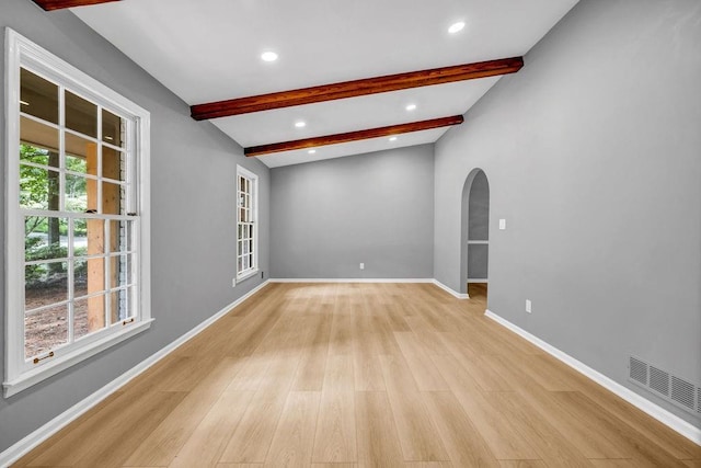4260 Bonaparte Dr, Tucker, GA 30084 - empty room with arched walkways, beam ceiling, light wood-style floors, and recessed lighting