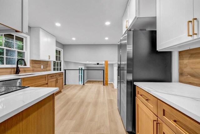 4260 Bonaparte Dr, Tucker, GA 30084 - kitchen featuring a ceiling fan, light stone countertops, recessed lighting, tasteful backsplash, and white cabinetry
