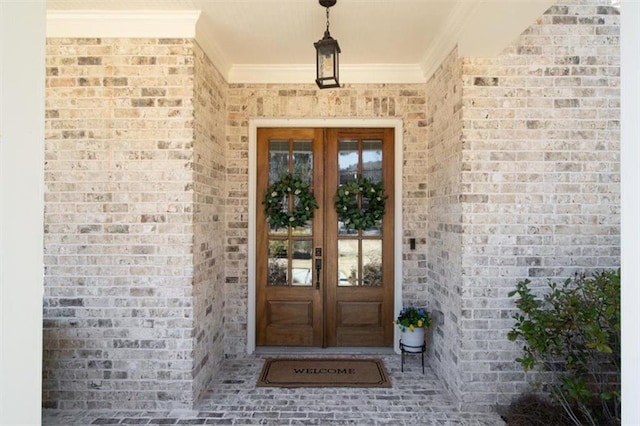 entrance to property with french doors and brick siding