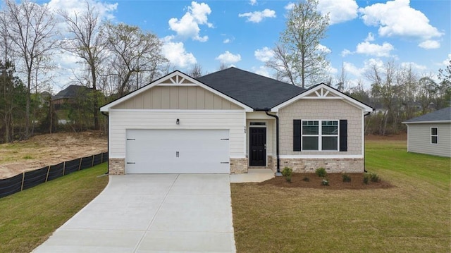 craftsman-style home featuring fence, concrete driveway, a front yard, and a garage