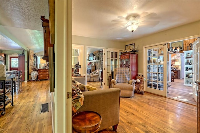 476 Franklin St, Dillard, GA 30537 - living area featuring ceiling fan, a textured ceiling, and wood finished floors
