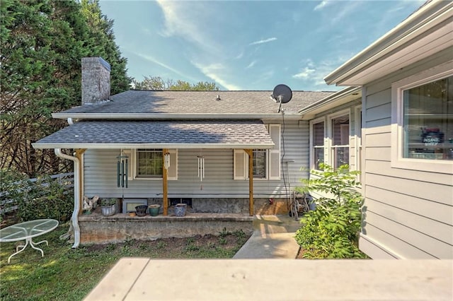 476 Franklin St, Dillard, GA 30537 - view of front of home with a chimney, a shingled roof, and covered porch