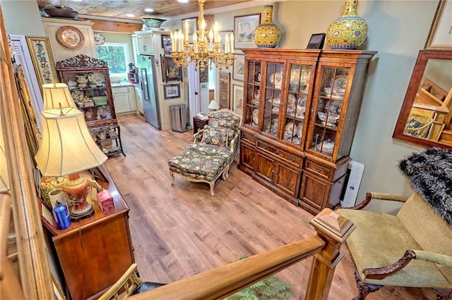 476 Franklin St, Dillard, GA 30537 - sitting room with a chandelier, light wood-type flooring, and crown molding