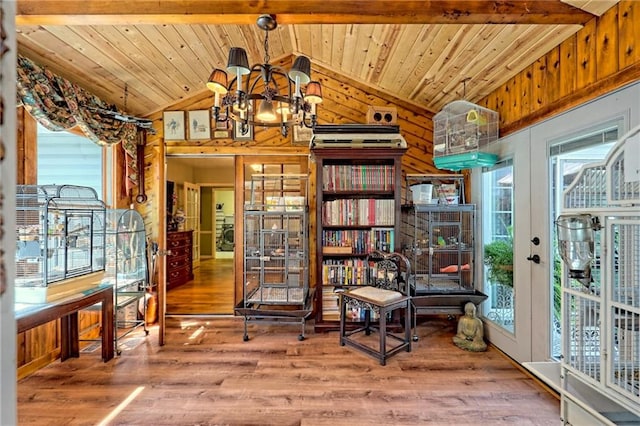 476 Franklin St, Dillard, GA 30537 - living area with lofted ceiling, wood finished floors, wooden ceiling, french doors, and wooden walls