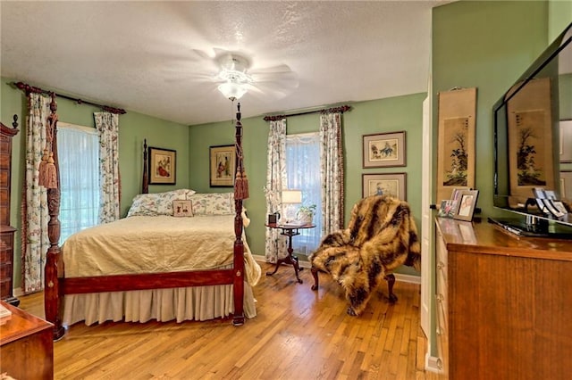 476 Franklin St, Dillard, GA 30537 - bedroom featuring hardwood / wood-style flooring, a textured ceiling, and ceiling fan